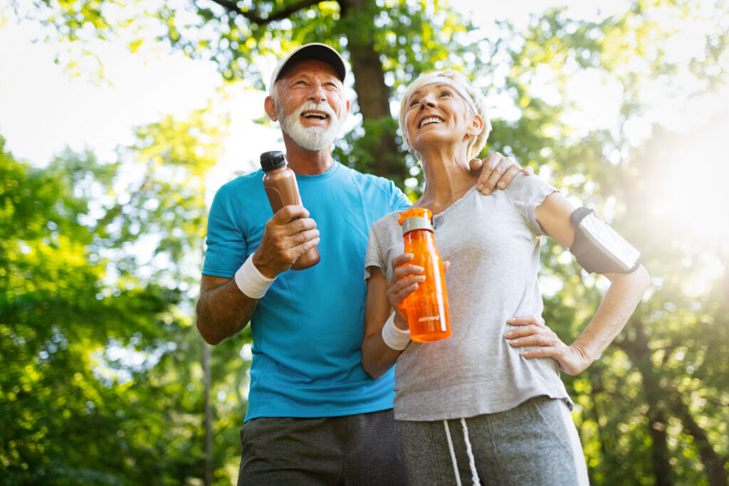 Senior couple staying hydrated after workout outdoor